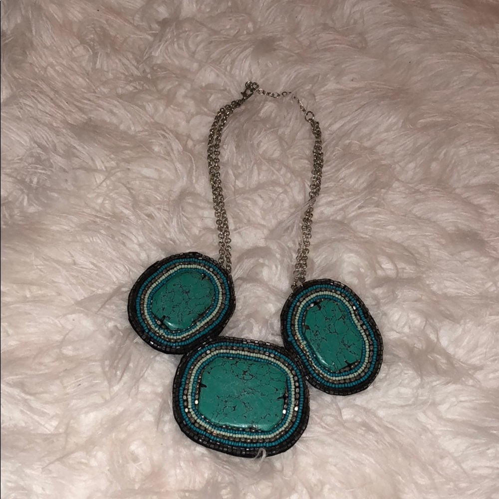 Turquoise and silver necklace.